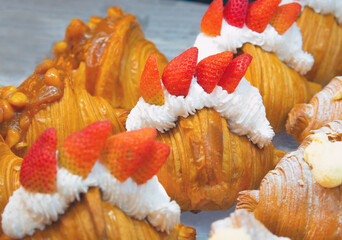 Fresh croissants topped with fresh strawberries. - 508653008