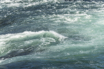 Fast currents in Rhine Falls in spring.
