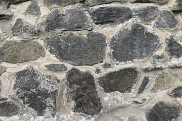 Grey stone texture, masonry made of natural stones