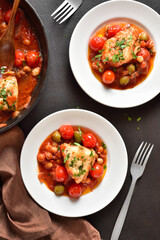 Cod stew with chickpeas, cherry tomatoes and olives