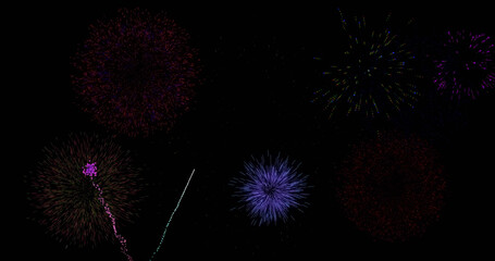 Image of colourful christmas and new year fireworks exploding in night sky