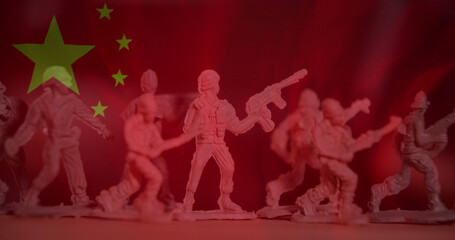 Obraz na płótnie Canvas Image of flag of china over toy soldiers