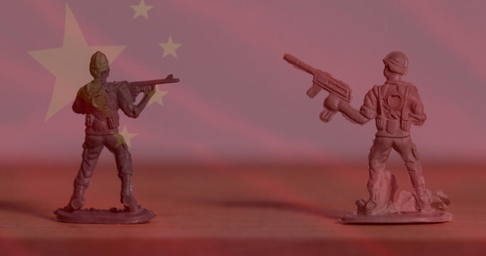 Image of flag of china over toy soldiers