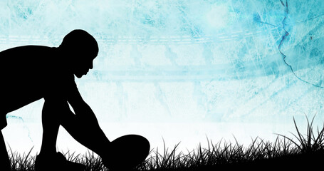 Image of diagonal blue stripe moving over silhouetted male rugby player placing ball on grass