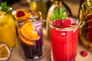 Fresh lemonade drinks with delicious raspberry and oranges