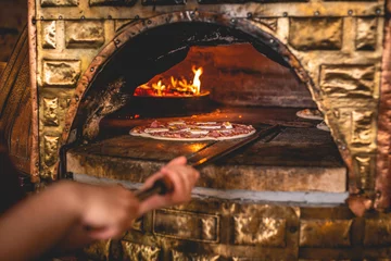 Foto auf Acrylglas Pizza in the traditional pizza oven, pizzeria © Robert