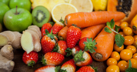 Image of fresh organic vegan food with fruit and vegetables on wooden boards