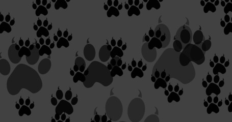 Image of black dog paw prints filling dark grey background