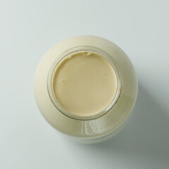 Homemade sour cream in a jar, fermented curdled milk.