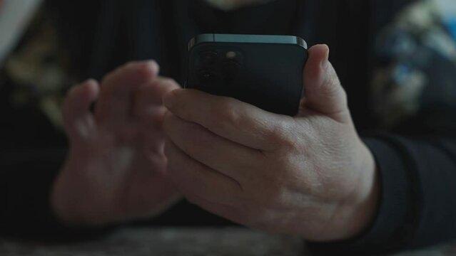 Woman with smartphone. Elderly woman using mobile phone, typing mesage, reading news