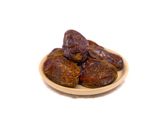 Dried dates on a white background