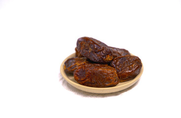 Dried dates on a white background