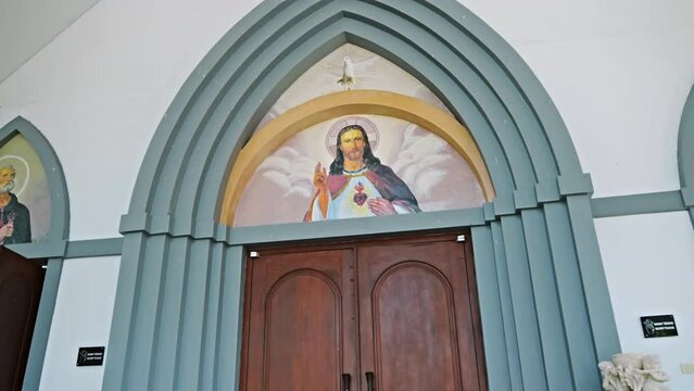 Picture of Jesus in the top of the door to the church