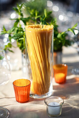 Candles and pasta on the wedding table