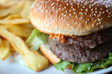 double burger topped with close-up chips