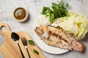 Grilled tilapia with salt and seafood sauce