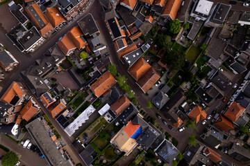 Top down aerial view of Groenlo small Dutch city in The Netherlands with authentic historic rooftops. Urban planning, development and housing market concept.
