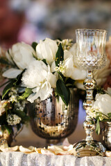 Bouquet flower in vase on the wedding table