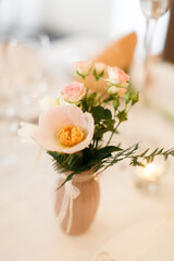 Bouquet of flowers in vase on the wedding table
