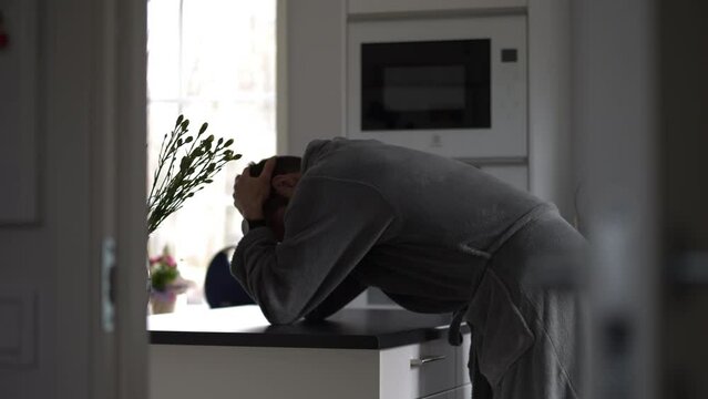 man is having a mental health episode, holding his head in despair