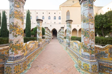 Zelfklevend Fotobehang Santa Chiara Monastery Naples Italy tiled pillars plated at the cloister garden © francesco