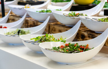 Salad bar with fresh vegetables in buffet in all inclussive hotel
