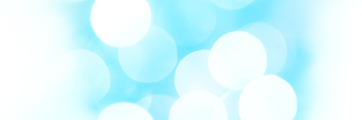 Bright blue sparkling glitter bokeh background, banner texture. Abstract defocused lights header. Wide screen wallpaper. Panoramic web banner with copy space for design
