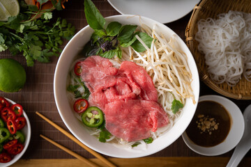 authentic vietnamese pho rice noodle with raw beef