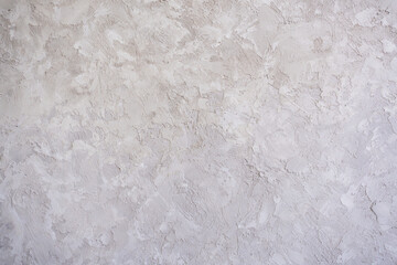 artistic plaster on a gray and white wall. Repairs. elements of wall decor. copy space. texture. background.