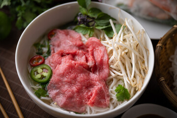 Fototapeta premium authentic vietnamese pho rice noodle with raw beef