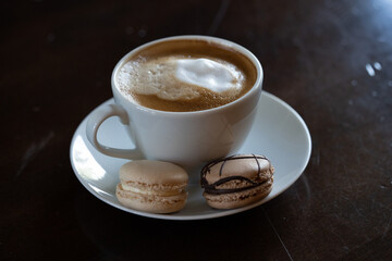Latte with meringue cookies chocolate