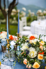 Bouquets of flowers in vase on the wedding table