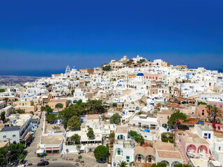Fototapeta na wymiar Top view of classic Greek architecture - white houses under the hot sun