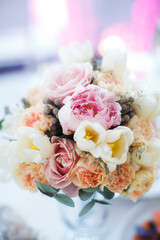 Bouquet of flowers in vase on the wedding table