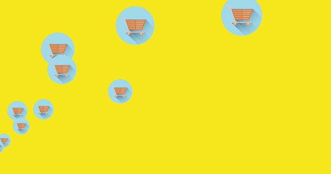 Image of falling shopping cart over yellow background