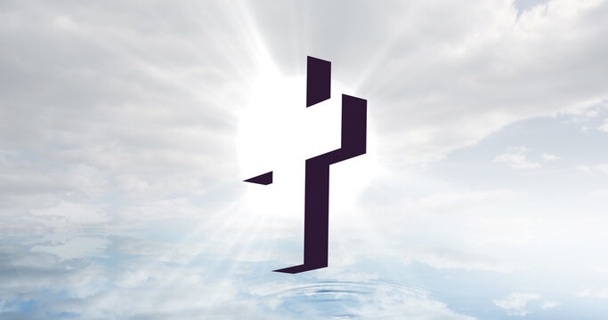 Image of christian cross over sun rays and clouded sky