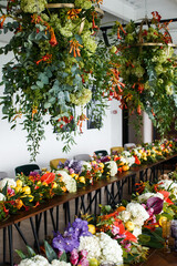 Bouquets of flowers and fruits in vase on the wedding table
