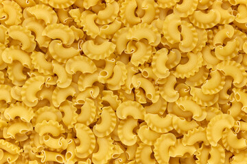 Background of dried macaroni cockerel scallops close up