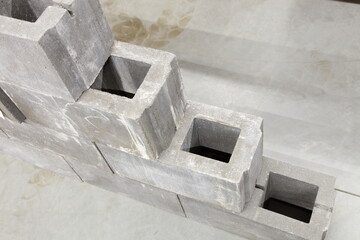 New gray concrete ventilated  wall blocks close up in stack. Building materials production storage and retail