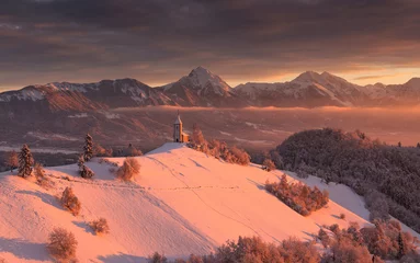 Fotobehang Jamnik on a beautiful winter morning with fresh snow and a vivid sunrise.   © gljivec