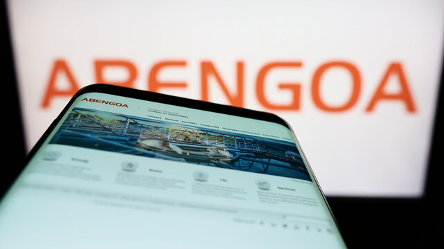 Stuttgart, Germany - 05-21-2022: Smartphone with website of Spanish infrastructure company Abengoa S.A. on screen in front of business logo. Focus on top-left of phone display.