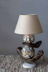 handmade table lamp made of driftwood and shells
