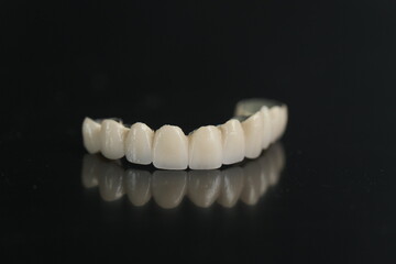 Metal free ceramic dental crowns. Dental ceramic bridge on isolated wite background