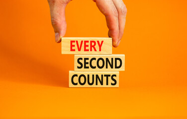Every second counts symbol. Concept words Every second counts on wooden blocks on a beautiful orange table orange background. Businessman hand. Business, motivational and every second counts concept.