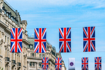 Rows of Union above Regent Street mark the Queen's Platinum Jubilee celebrations. Selective focus - obrazy, fototapety, plakaty