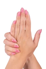 Poster Woman's hands with pink nails manicure Isolated on white background. © Aleksei