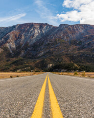 Views along the Alaska Highway in fall, autumn season with magnificent, towering mountains in the distance. 