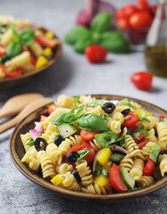 A bowl with traditional Italian pasta salad