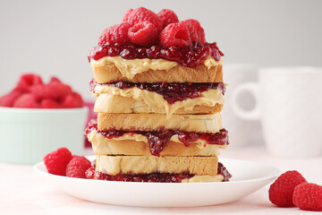 Sandwiches with peanut butter and raspberry jam