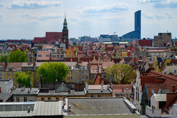 View of the market square in Wrocław over the roofs of houses. - obrazy, fototapety, plakaty